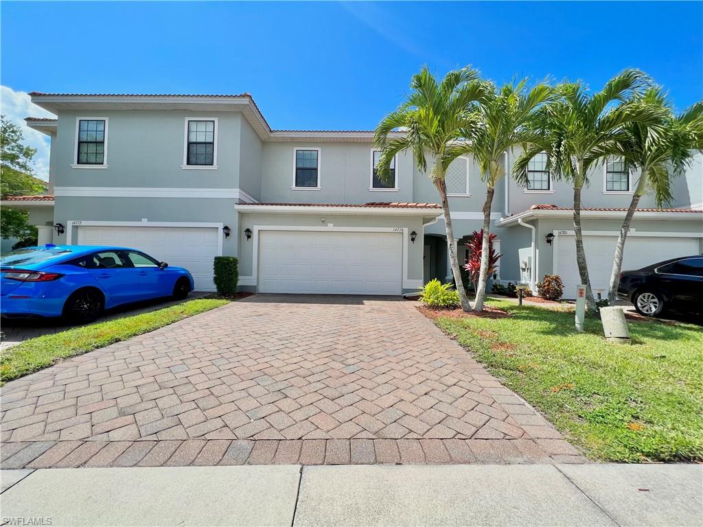 14776 Sutherland Avenue, Unit 416 Naples, FL 34119 - Photo 49 of 50 a front view of a house with garden