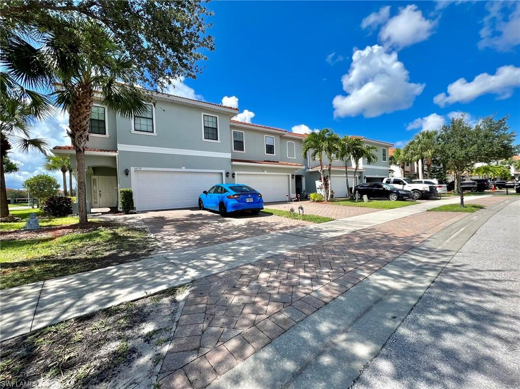 14776 Sutherland Avenue, Unit 416 Naples, FL 34119 - Photo 50 of 50 a view of a street with houses