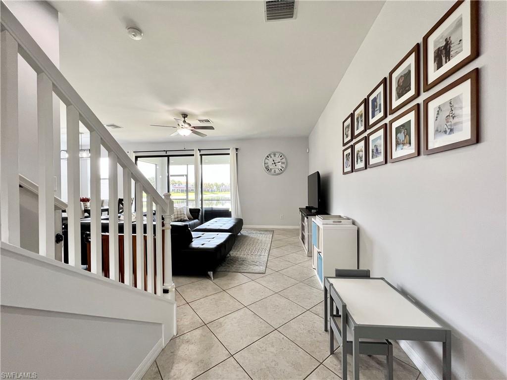 14776 Sutherland Avenue, Unit 416 Naples, FL 34119 - Photo 7 of 50 a living room with furniture and a large window