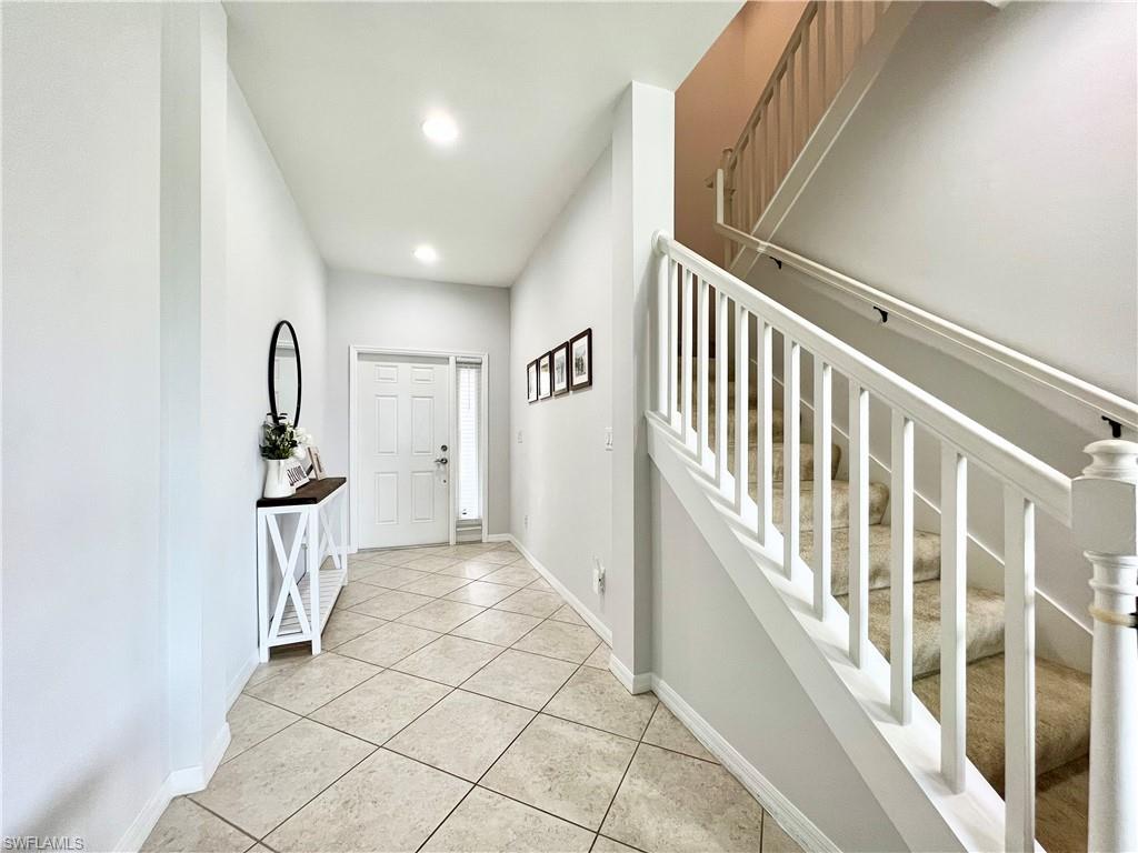 14776 Sutherland Avenue, Unit 416 Naples, FL 34119 - Photo 8 of 50 a view of a hallway with stairs