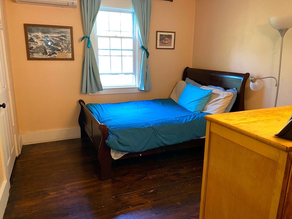 8 May Street Beverly, MA 01915 - Photo 14 of 25 a bed room with a bed and a window