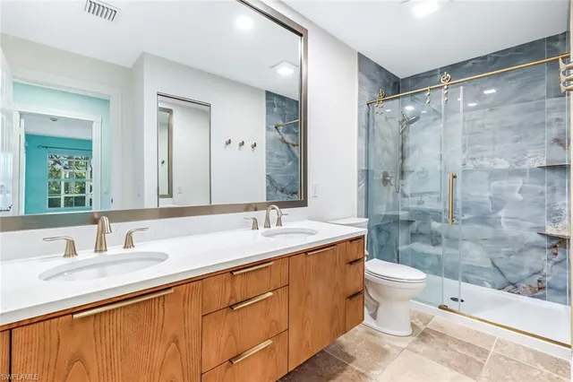 an empty room with a window and a ceiling fan