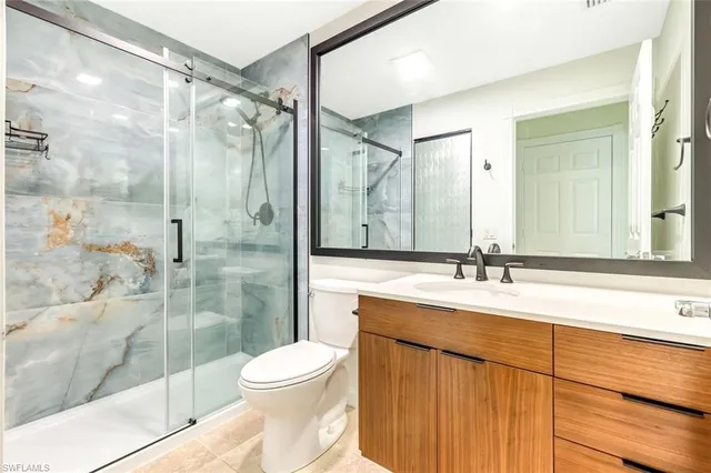 a utility room with cabinets washer and dryer