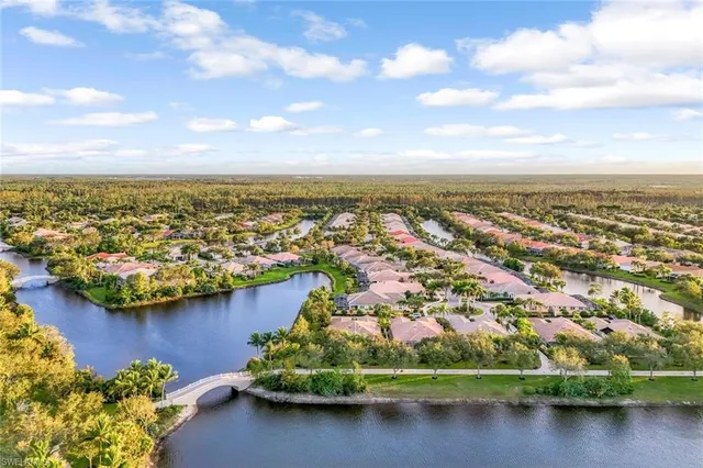a view of a pathway with a wrought fence