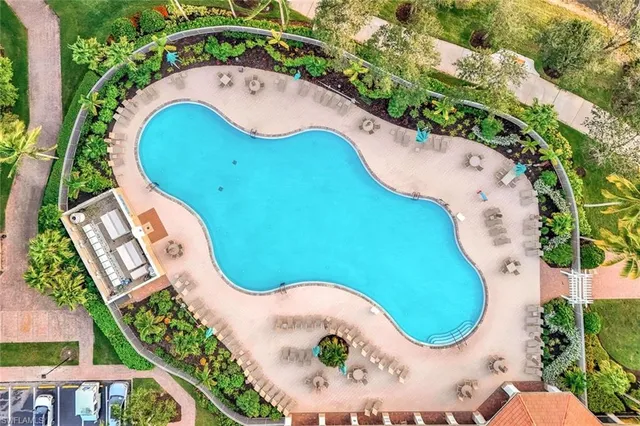 a street sign that is sitting in front of flowers