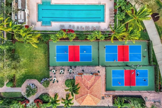 a living room with lots of furniture and a refrigerator