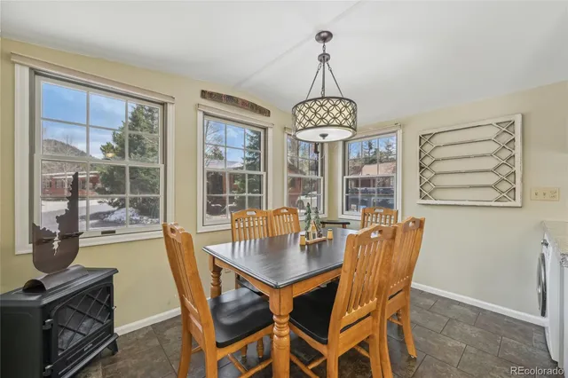 a bathroom with a granite countertop toilet sink and a mirror