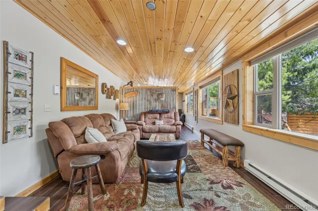 a view of a dining room with furniture wooden floor and chandelier