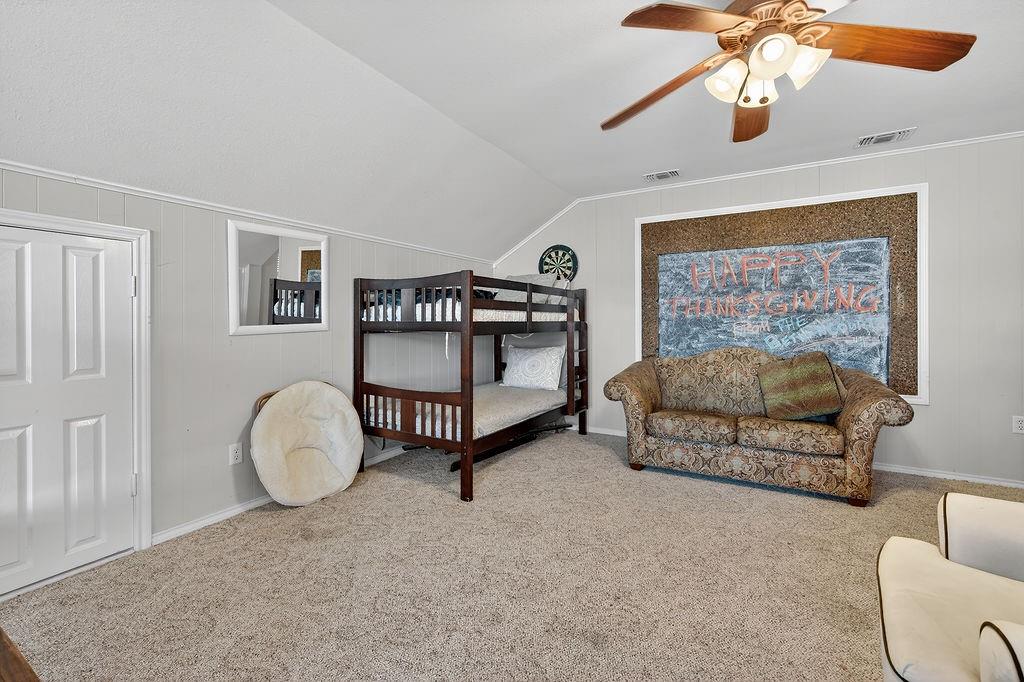 7811 Double Oaks Road Athens, TX 75752 - Photo 30 of 38 a bedroom with furniture and a window