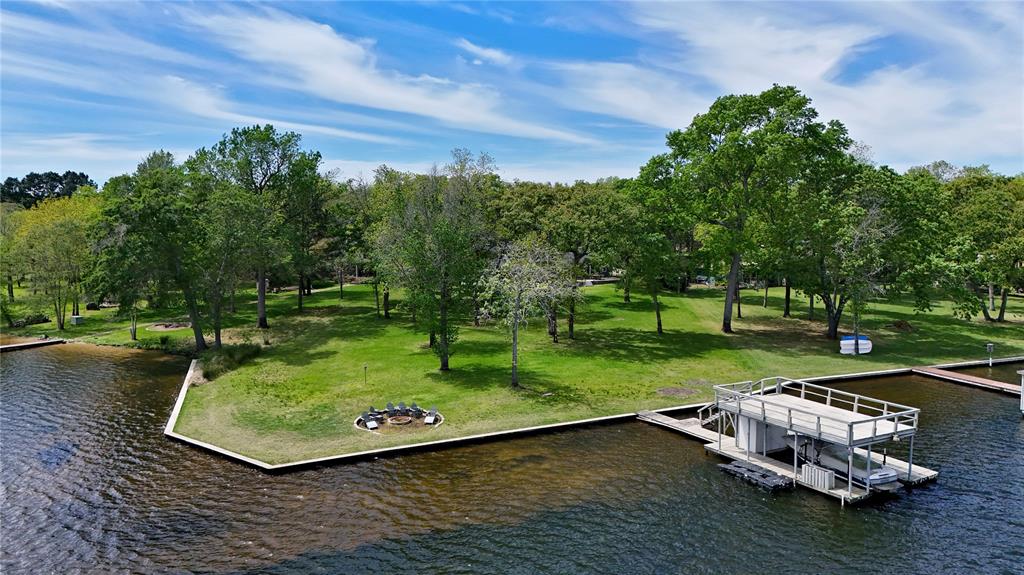 7811 Double Oaks Road Athens, TX 75752 - Photo 5 of 38 a view of a backyard with sitting area