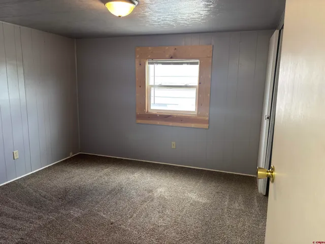 a view of a field with an ocean