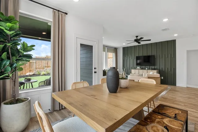 a dining room with furniture and window