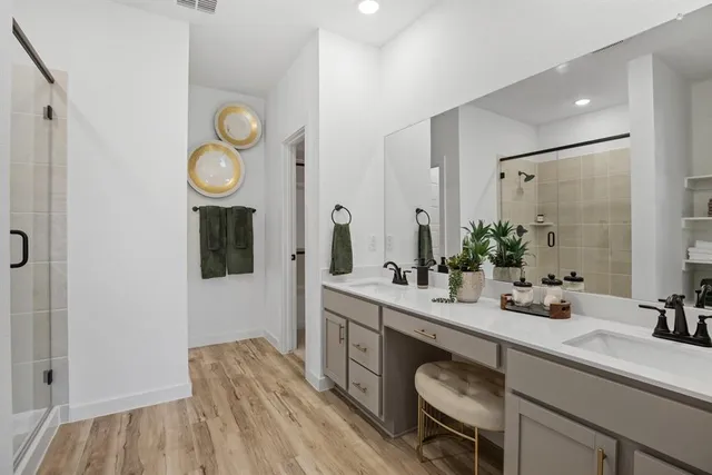 a spacious bathroom with a sink and a mirror