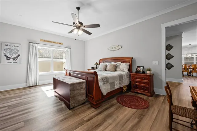 a bedroom with furniture and wooden floor