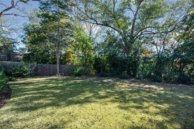 a swimming pool with wooden fence