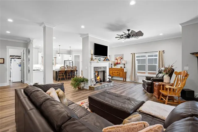a living room with furniture fireplace and a flat screen tv