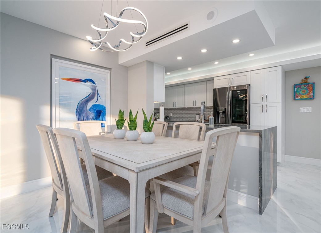 17 Bluebill Avenue, Unit 903 Naples, FL 34108 - Photo 7 of 33 a view of a dining room with furniture