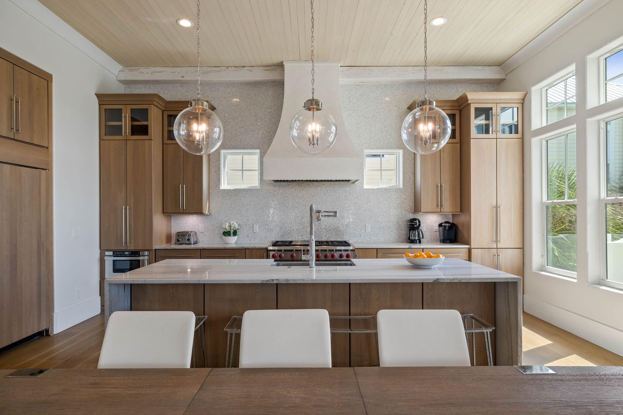 3537 East County Highway 30A Santa Rosa Beach, FL 32459 - Photo 30 of 56 a kitchen with stainless steel appliances granite countertop a sink a stove and a wooden floors