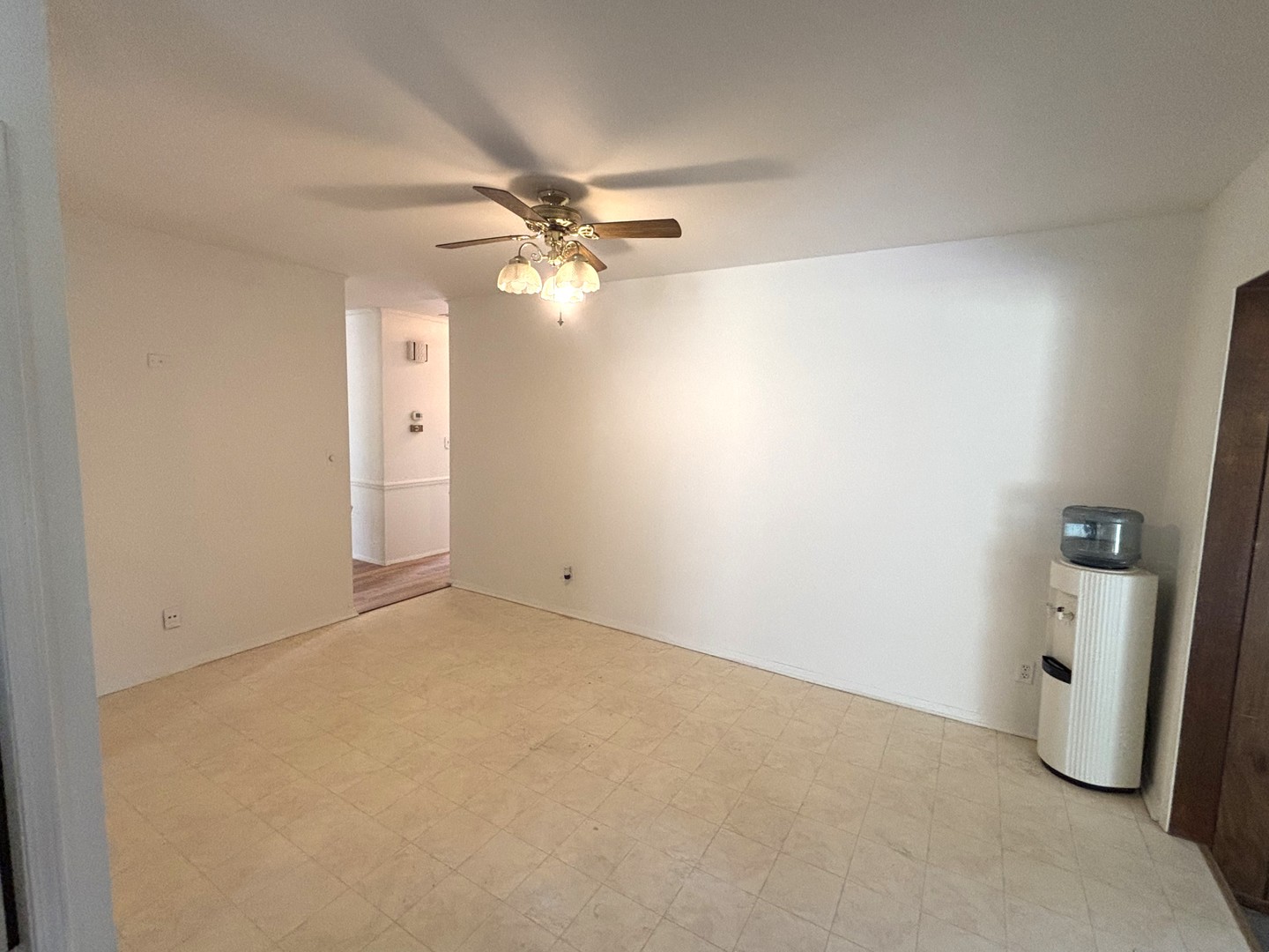 22 Guilford Road Montgomery, IL 60538 - Photo 6 of 14 an empty room with windows and fan