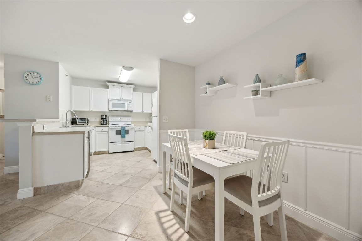 23583 Bahama Point, Unit 1521 Fernandina Beach, FL 32034 - Photo 9 of 34 Stylish Counter Overhang Ideal for Casual Dining with room for Barstools!