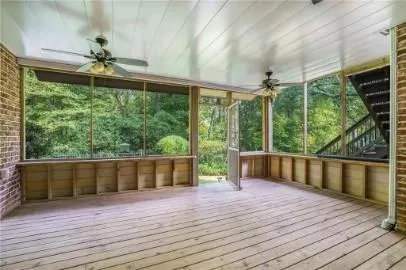 a view of porch with wooden floor