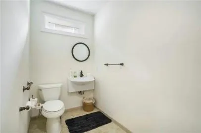 a bathroom with a toilet and a sink
