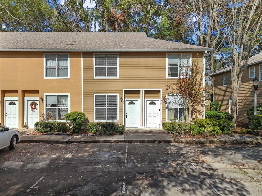 4415 Southwest 34th Street, Unit 707 Gainesville, FL 32608 - Photo 1 of 1 a front view of a house with garden