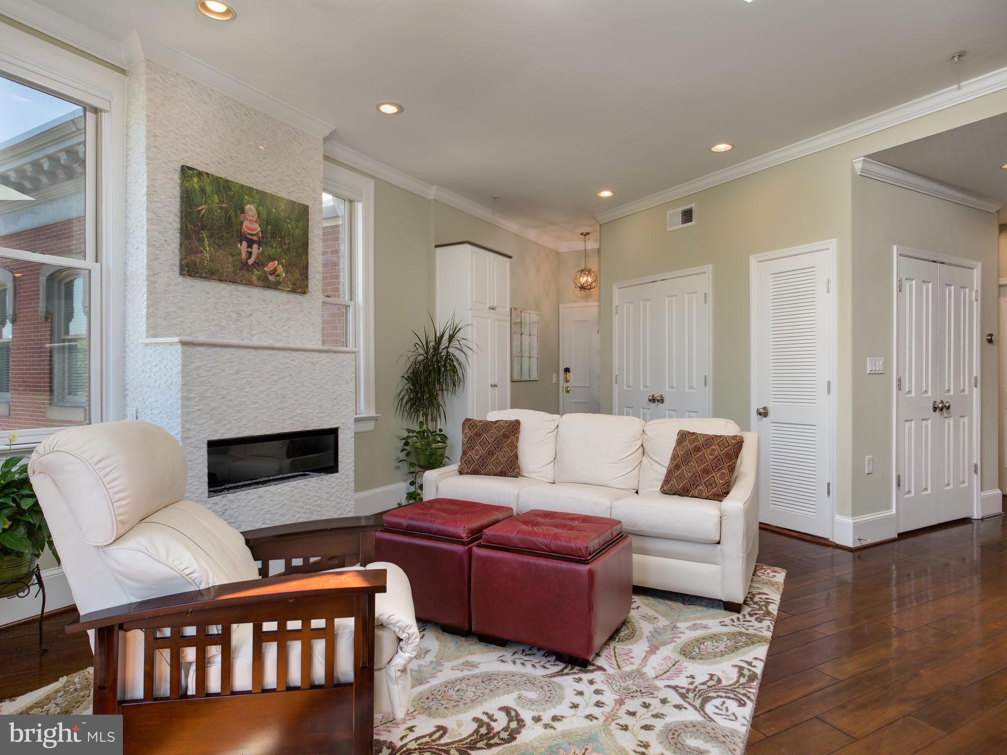 20 Logan Circle Northwest, Unit 33 Washington, DC 20005 - Photo 5 of 27 Mosaic Marble ventless gas fireplace.