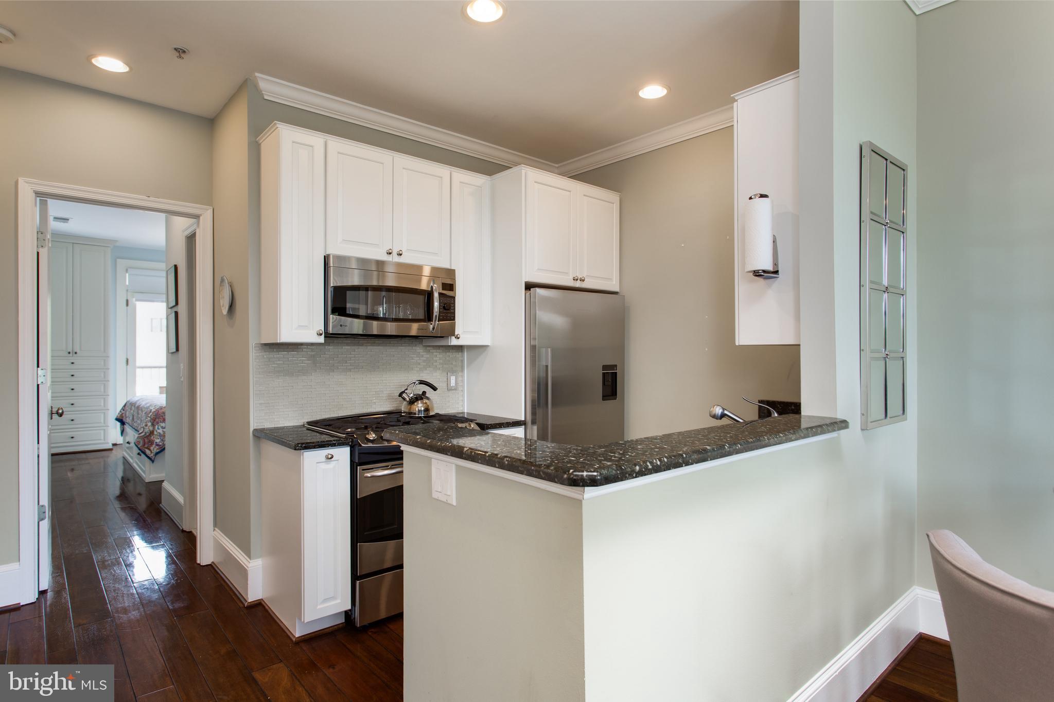 20 Logan Circle Northwest, Unit 33 Washington, DC 20005 - Photo 8 of 27 Updated kitchen with counter depth refrigerator
