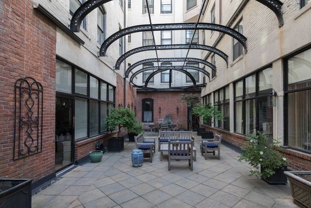 a view of a building with furniture and wooden floor