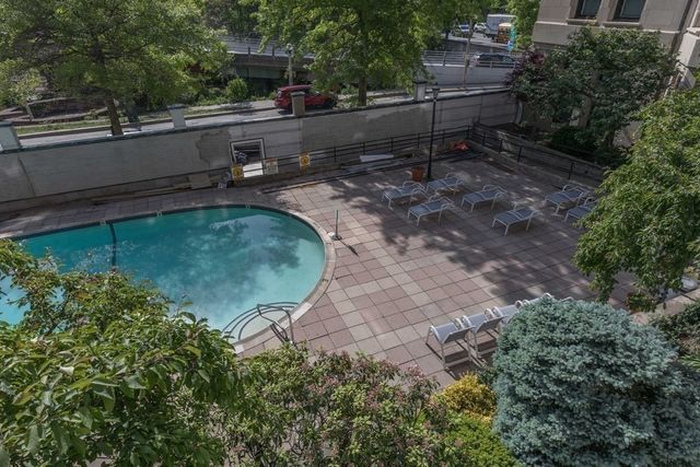 a view of a backyard with plants and outdoor seating