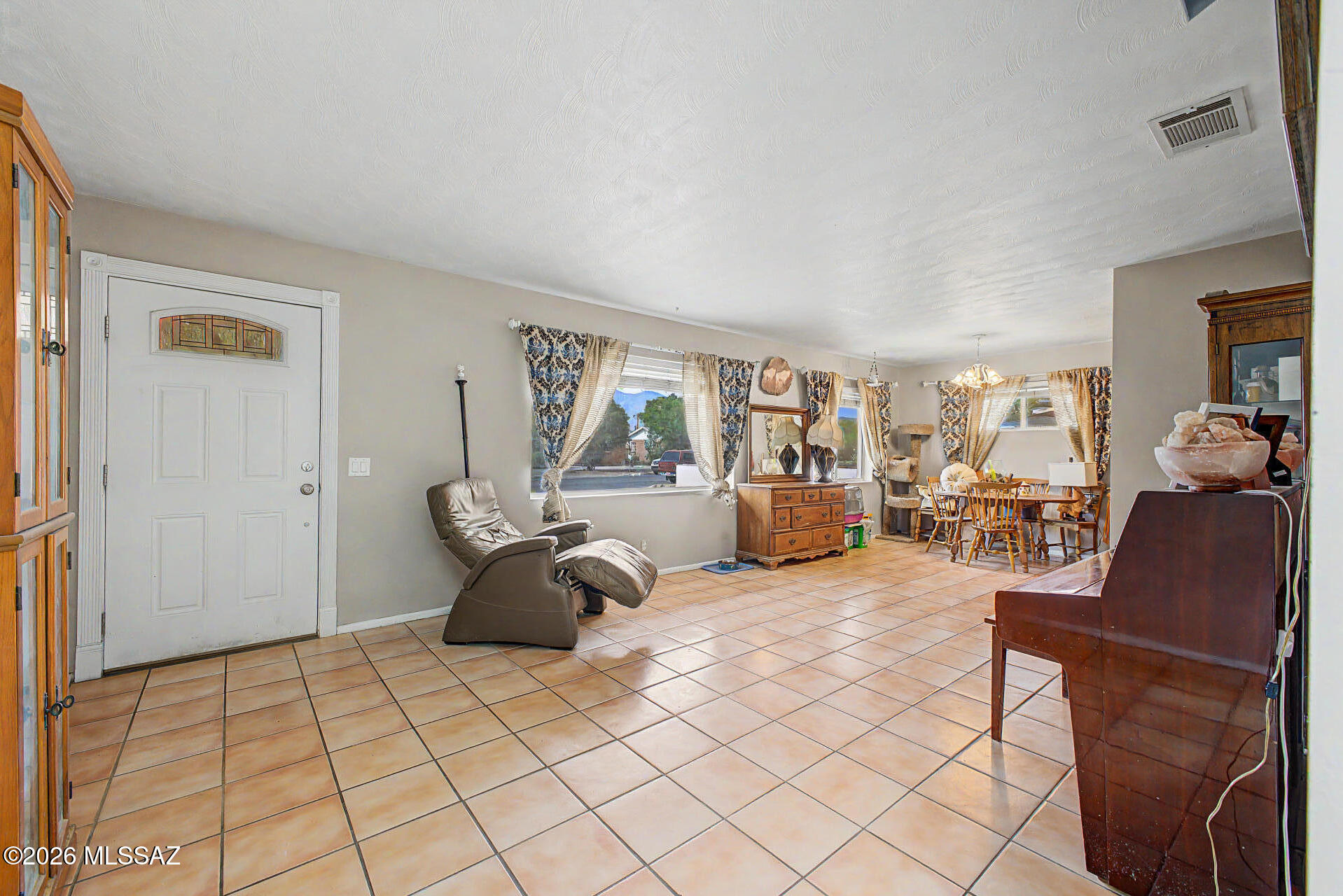 1172 East Allen Road Tucson, AZ 85719 - Photo 6 of 25 a living room with furniture and a window