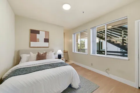 a bed room with a bed and a window