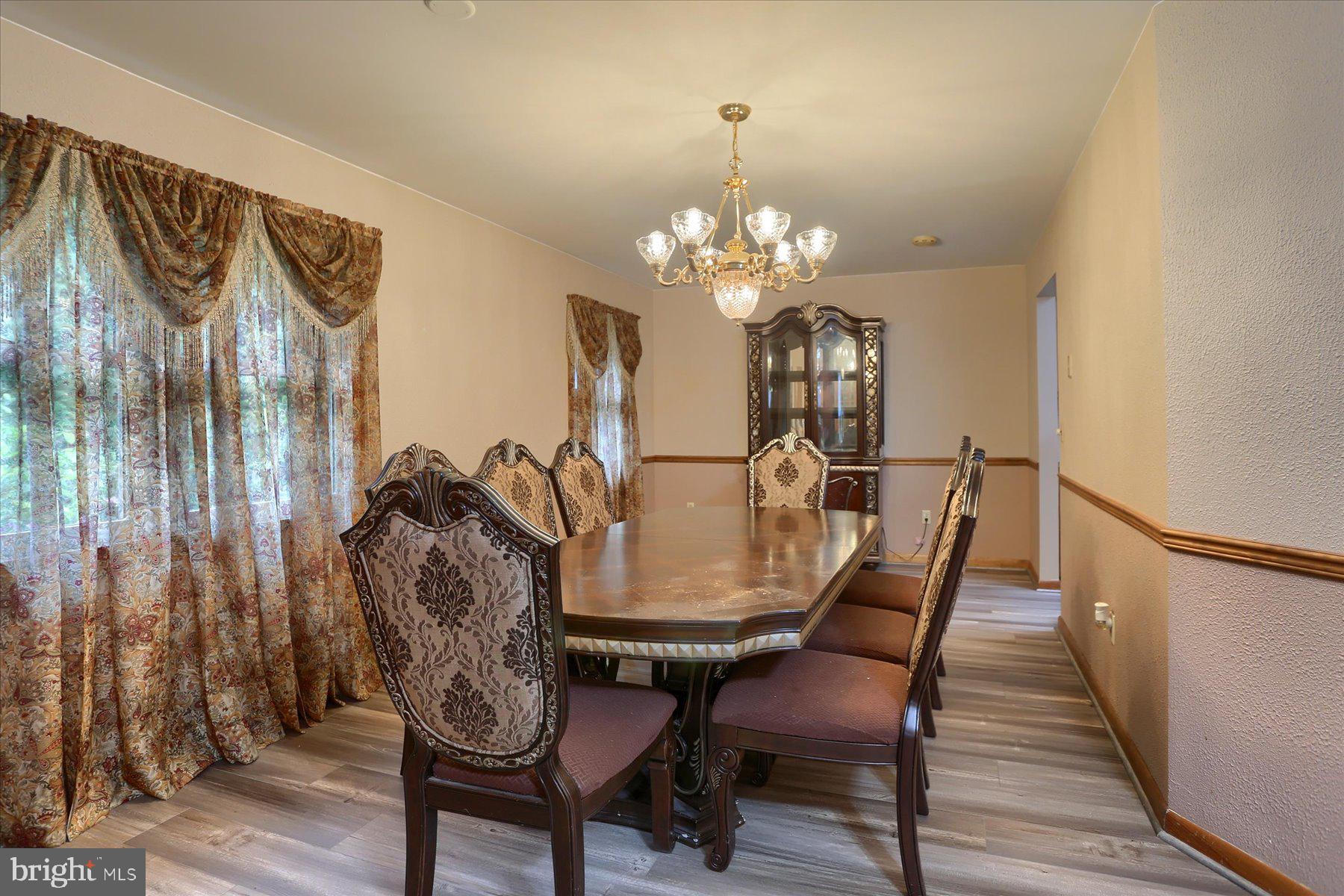 12 South Ridge Road Boiling Springs, PA 17007 - Photo 5 of 39 a view of a dining room with furniture and wooden floor