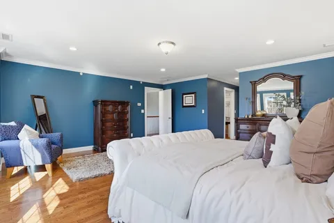 a bedroom with a bed and furniture