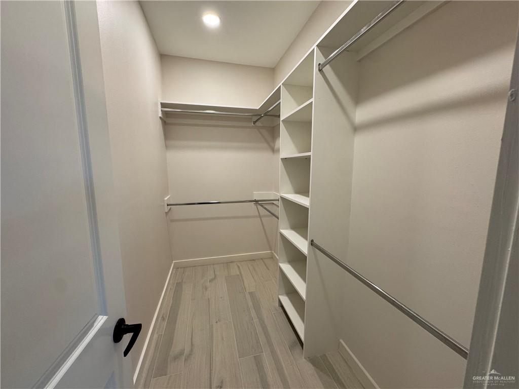 11509 North 25th Street, Unit A McAllen, TX 78504 - Photo 11 of 17 Spacious closet featuring light wood-style flooring
