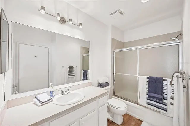 a view of a lake with a house in the background