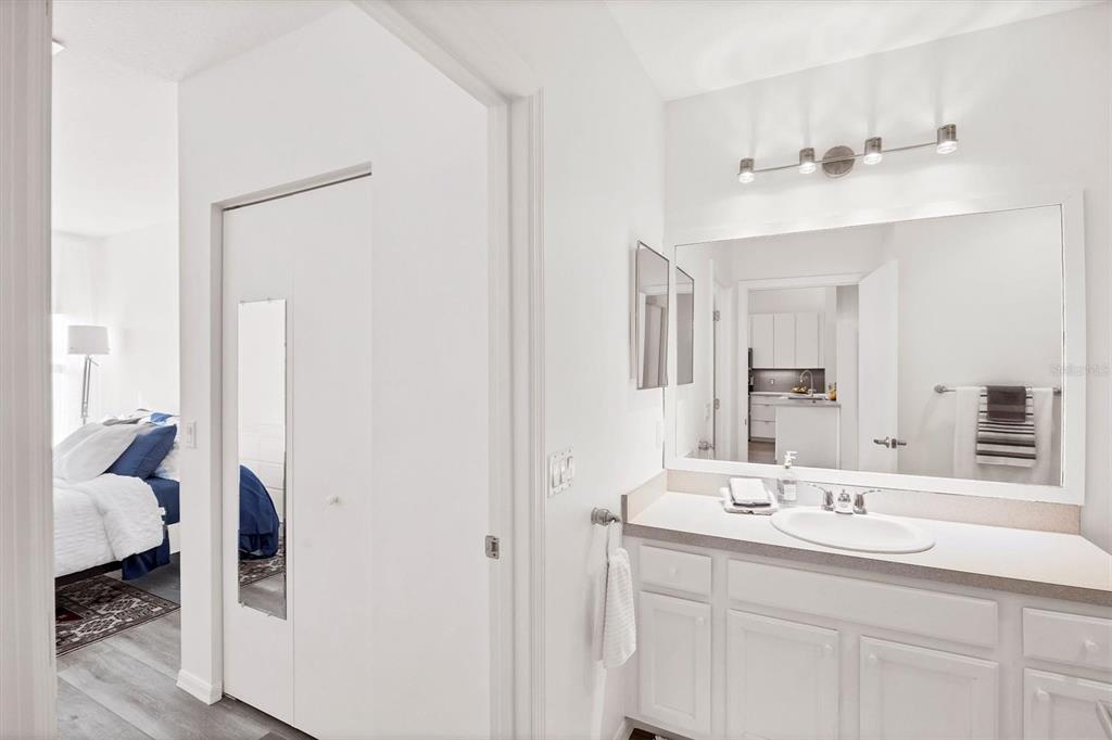 7131 Boca Grove Place, Unit 203 Lakewood Ranch, FL 34202 - Photo 24 of 50 a bathroom with a sink and a mirror