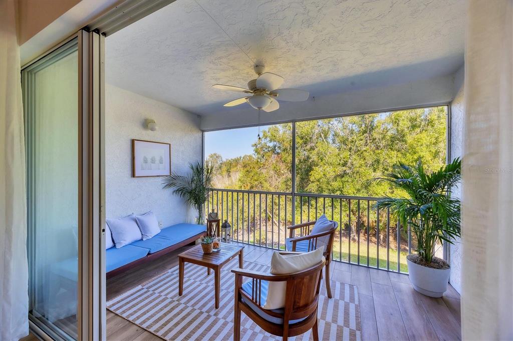 7131 Boca Grove Place, Unit 203 Lakewood Ranch, FL 34202 - Photo 27 of 50 a view of a chairs and table in a balcony