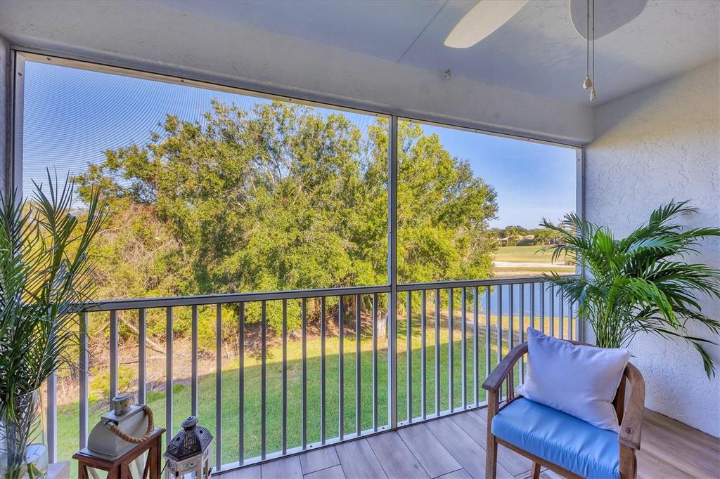 7131 Boca Grove Place, Unit 203 Lakewood Ranch, FL 34202 - Photo 28 of 50 a view of a porch with furniture
