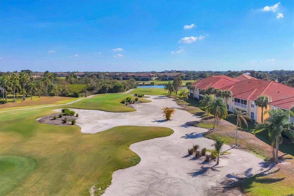 7131 Boca Grove Place, Unit 203 Lakewood Ranch, FL 34202 - Photo 33 of 50 an aerial view of a house with a garden