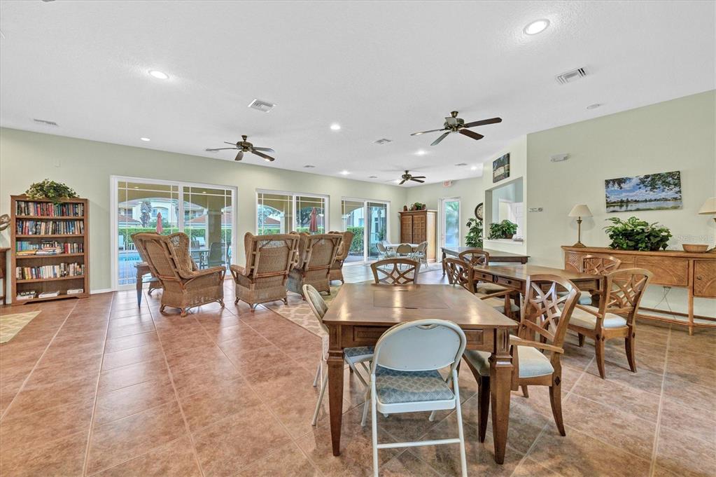 7131 Boca Grove Place, Unit 203 Lakewood Ranch, FL 34202 - Photo 36 of 50 a view of a dining room with furniture