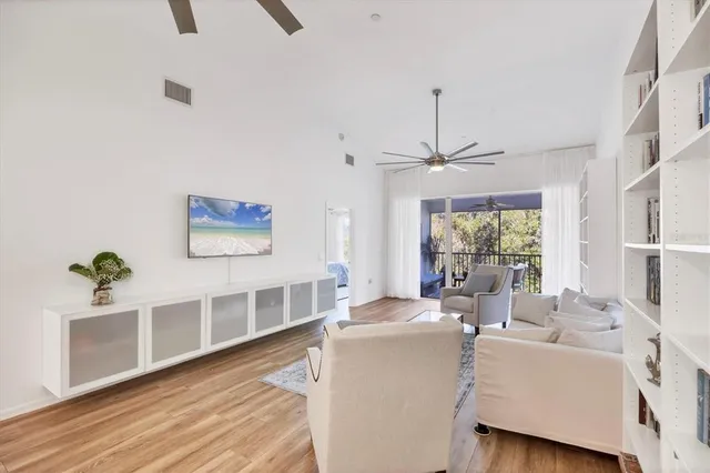 a kitchen with stainless steel appliances granite countertop a stove a sink and white cabinets