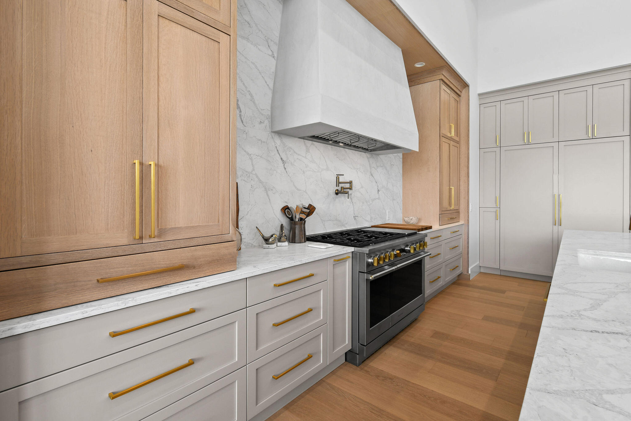 9105 Whippoorwill Trail Jupiter, FL 33478 - Photo 15 of 60 a kitchen with granite countertop white cabinets and white appliances