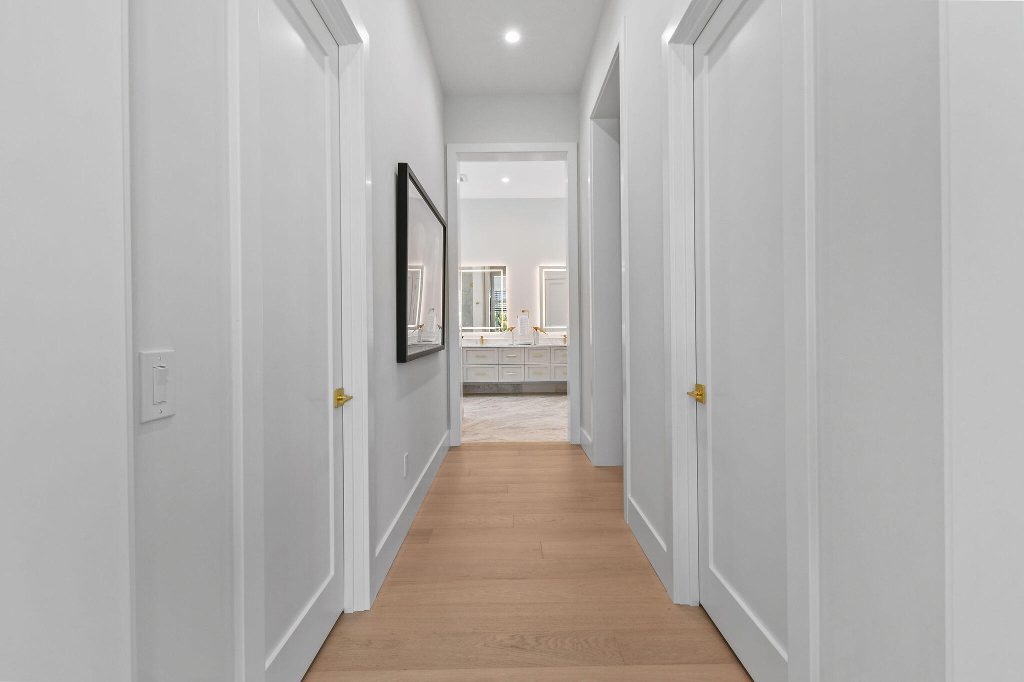 9105 Whippoorwill Trail Jupiter, FL 33478 - Photo 26 of 60 a view of a hallway with wooden floor and entryway