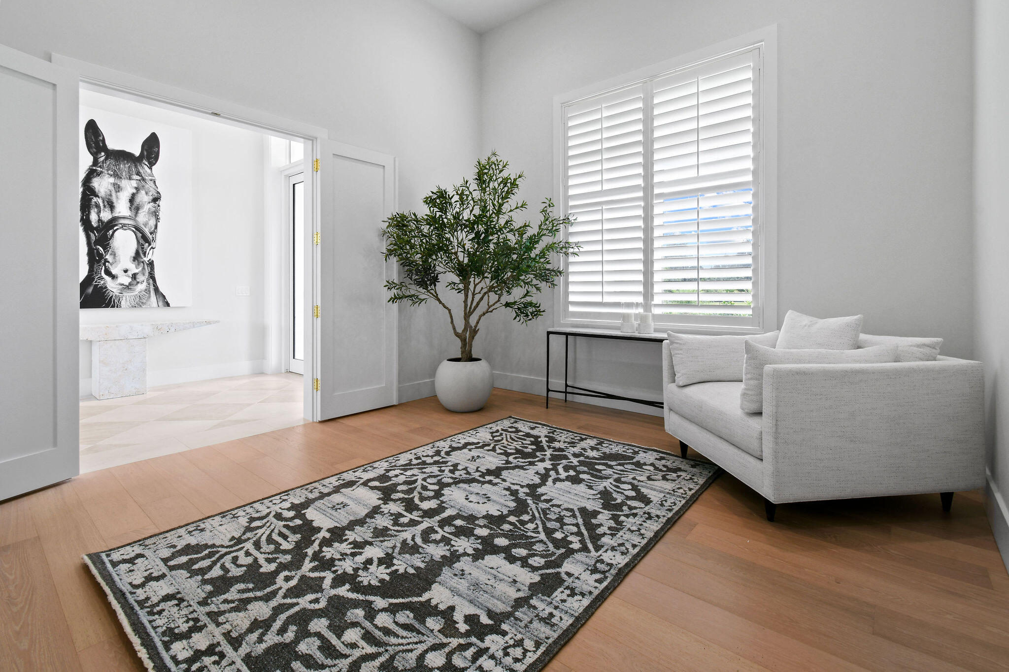 9105 Whippoorwill Trail Jupiter, FL 33478 - Photo 45 of 60 a living room with furniture and a window