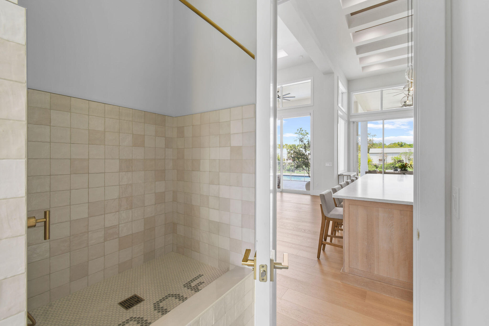 9105 Whippoorwill Trail Jupiter, FL 33478 - Photo 50 of 60 a bathroom with a bathtub and a shower