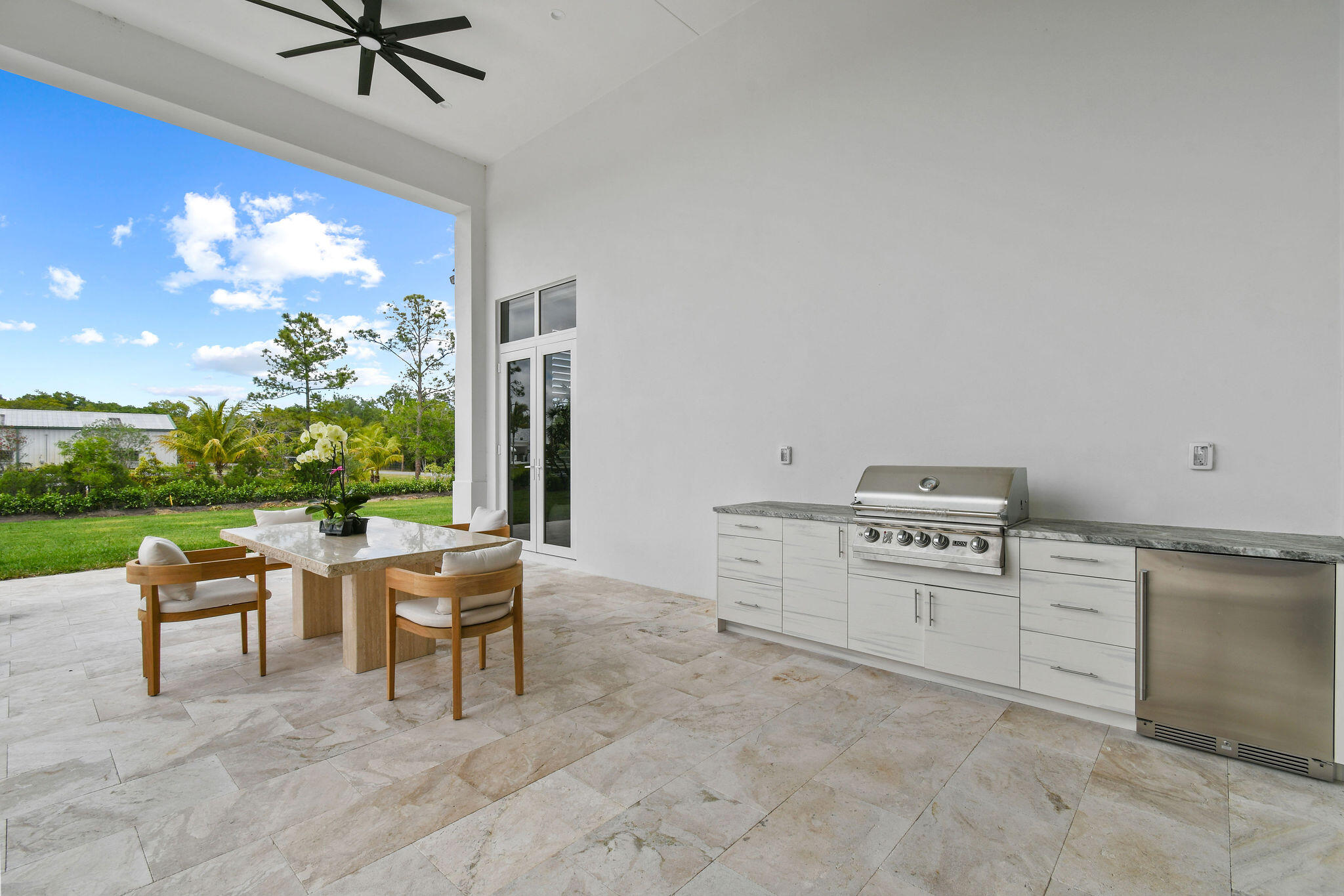 9105 Whippoorwill Trail Jupiter, FL 33478 - Photo 54 of 60 a room with furniture and a window