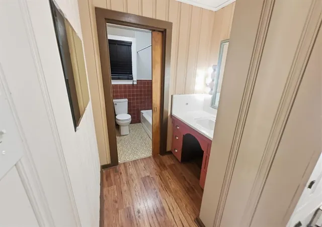 a bathroom with a sink and toilet