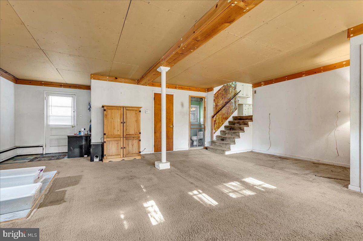 995 Smithbridge Road Glen Mills, PA 19342 - Photo 9 of 20 a view of a livingroom with furniture and stairs